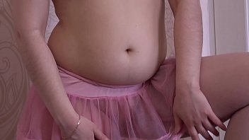 A Girl In A Pink Skirt And In Stockings Masturbates Her Pussy
