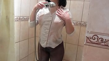 Girl In A White Blouse In Black Pantyhose Masturbates In The Shower To Orgasm